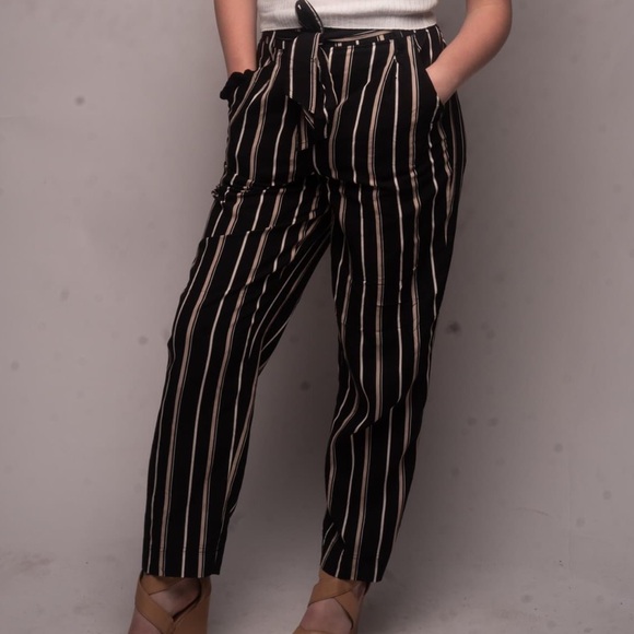 Pants - Black and white stripped pants that tie with a matching “belt”.